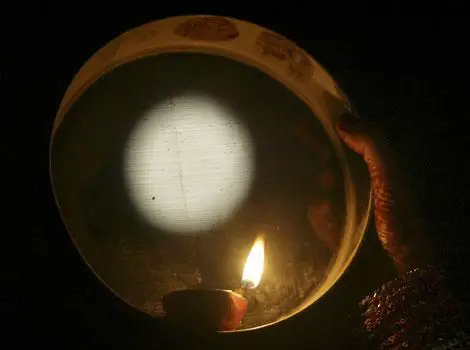A ritual of this festival - looking at moon from sieve